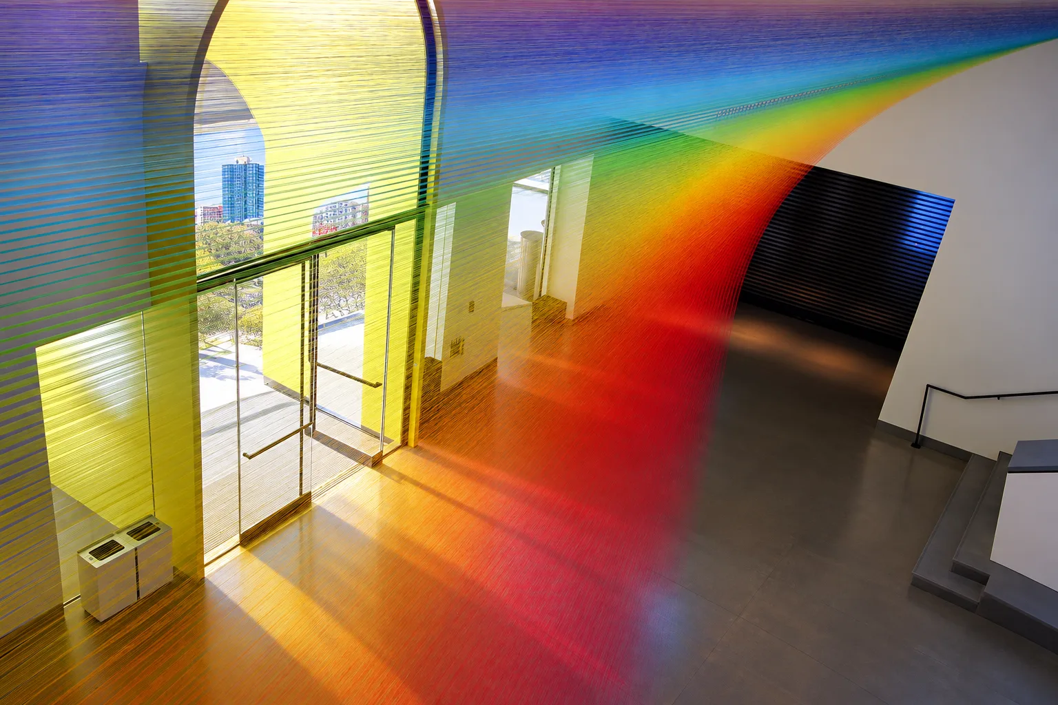 Prismatic rainbow light crossing the Smith Building lobby