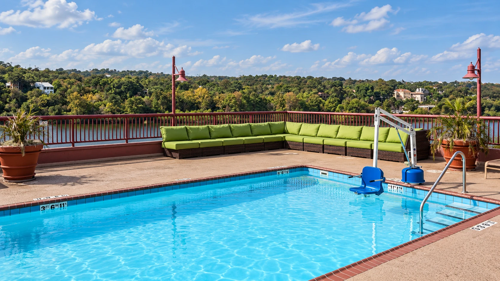 Rooftop pool and green corner seating at Holiday Inn Austin–Town Lake