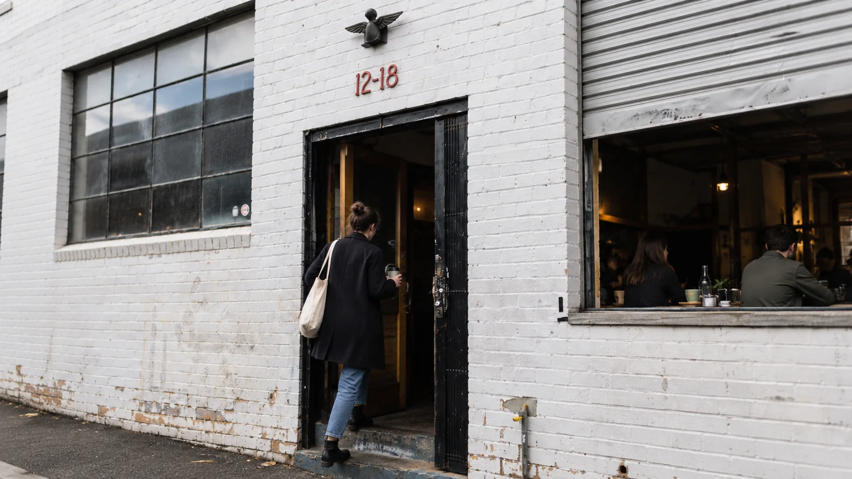 ST. ALi’s white warehouse frontage on Yarra Place