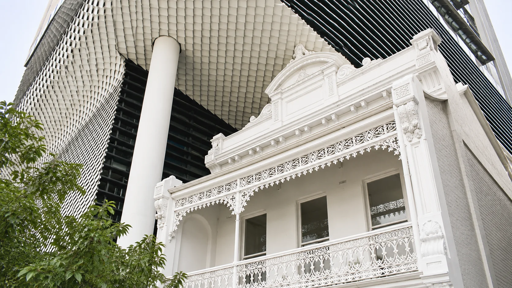 The Kettle Black’s white terrace balcony beneath Fifty Albert