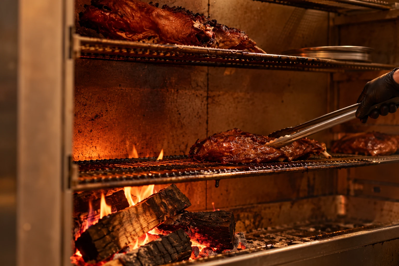 Cooking over the wood fire at Serai Kitchen