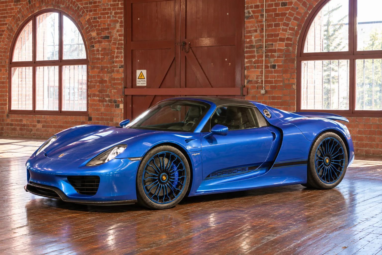 The blue Porsche 918 Spyder, shown in full in the collection gallery.