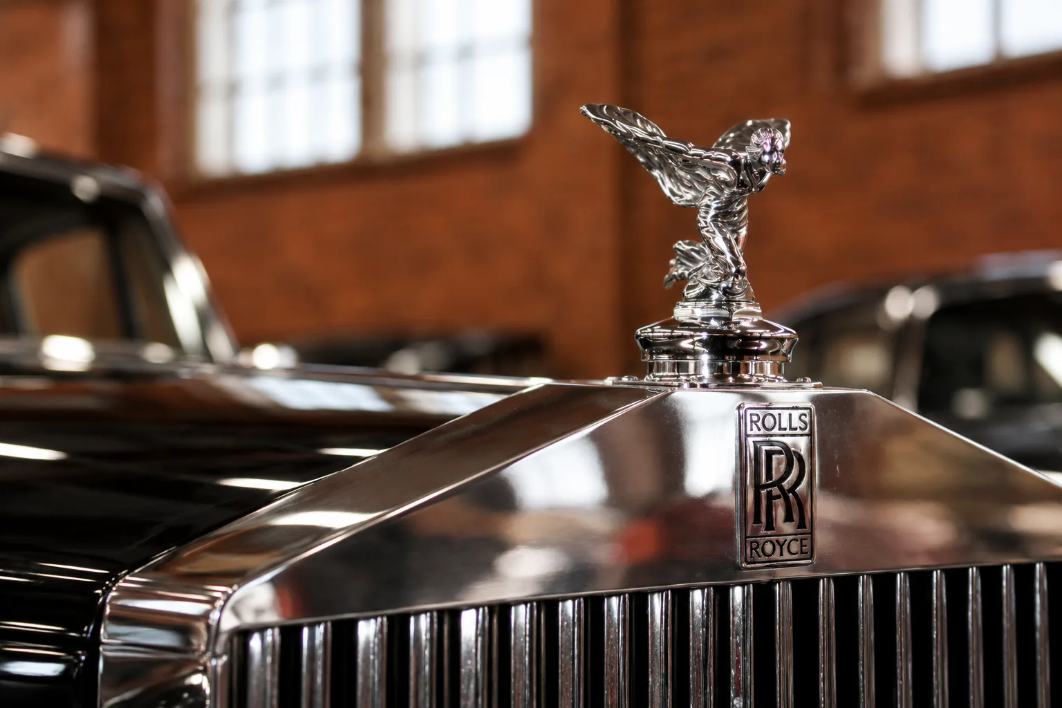 The Rolls-Royce Spirit of Ecstasy above its polished radiator grille.