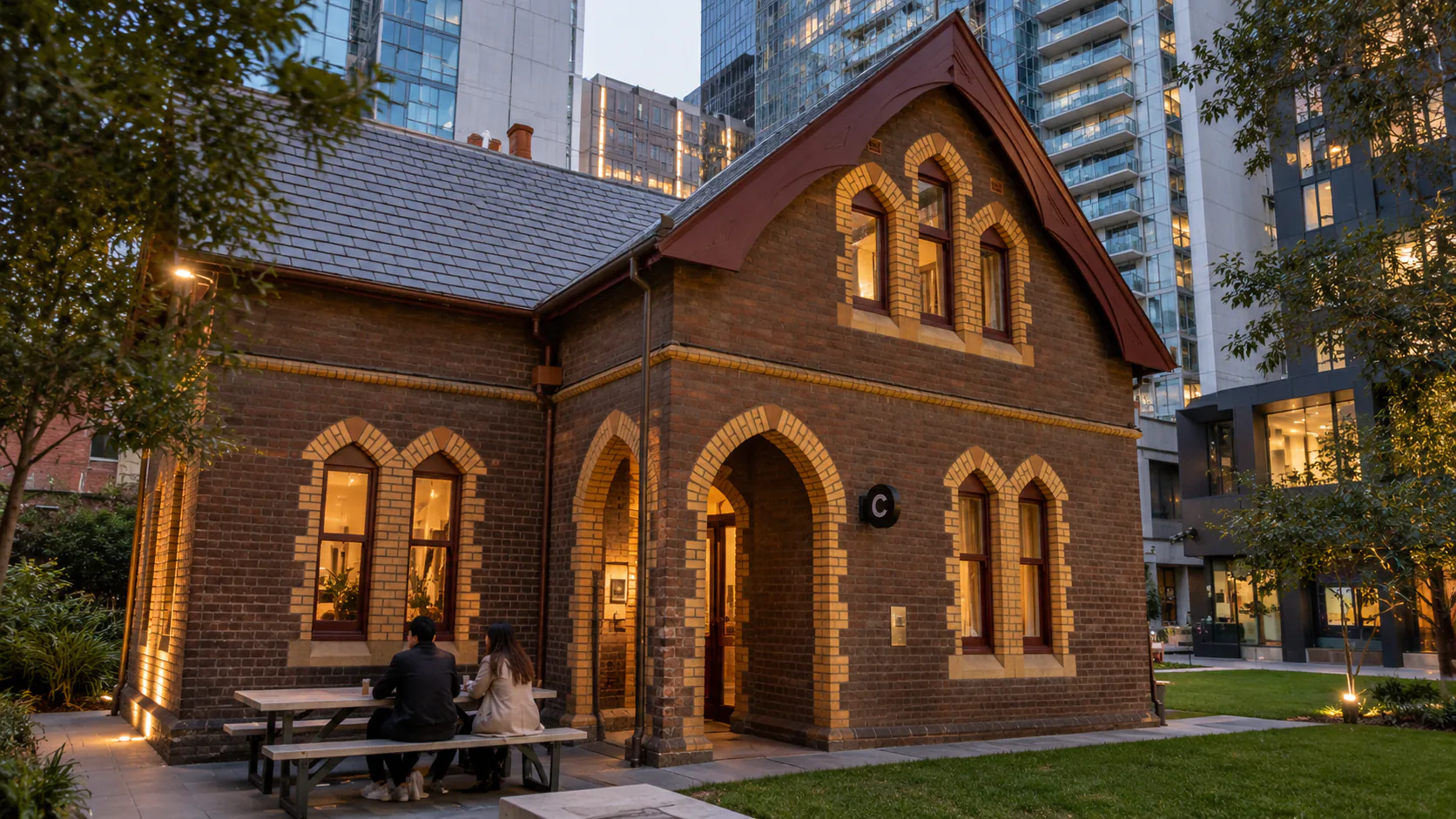 Caretaker’s Cottage brick frontage and courtyard in Melbourne