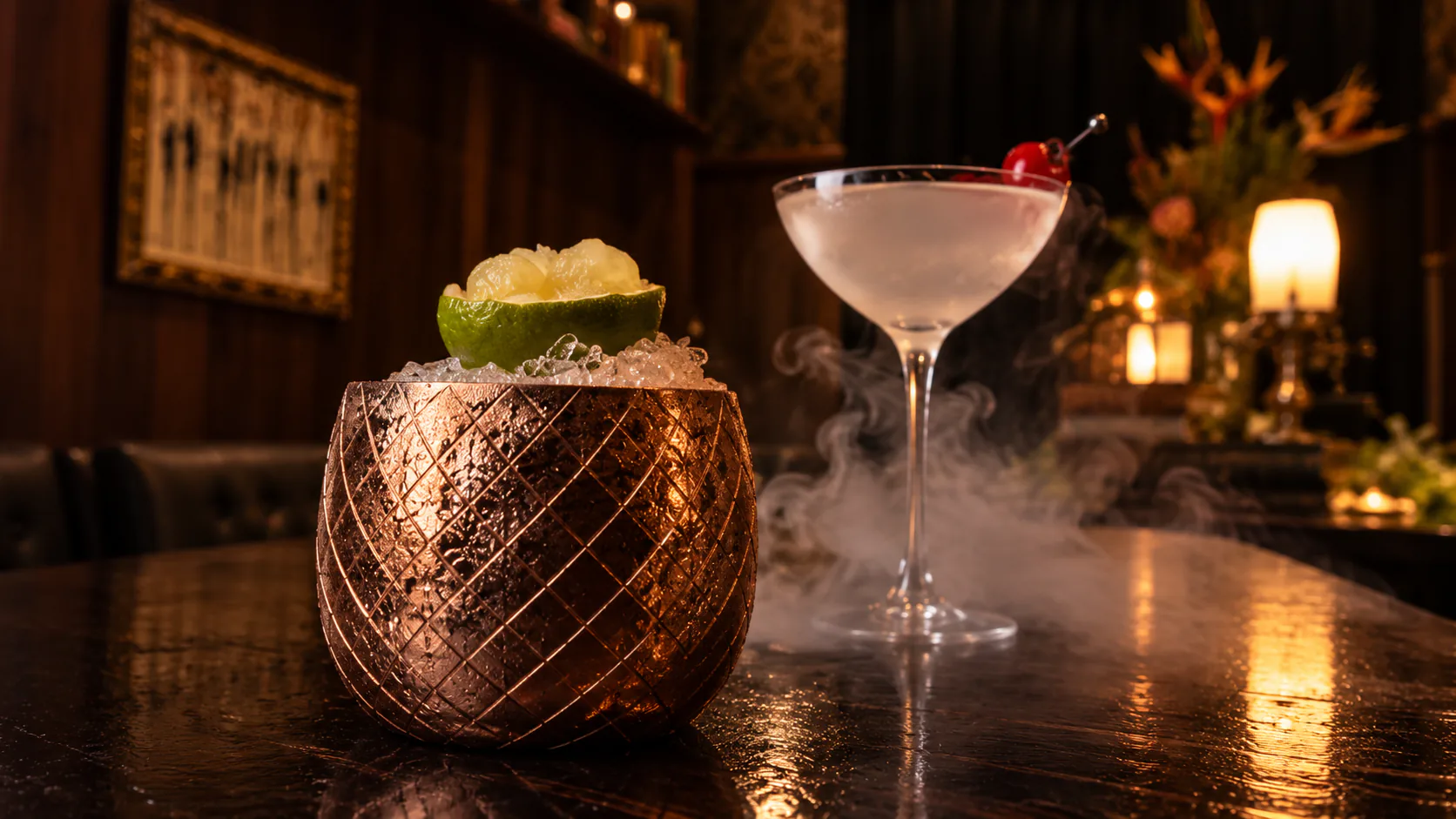 A copper-cup cocktail with lime garnish and a chilled stemmed cocktail at Eau de Vie Melbourne.
