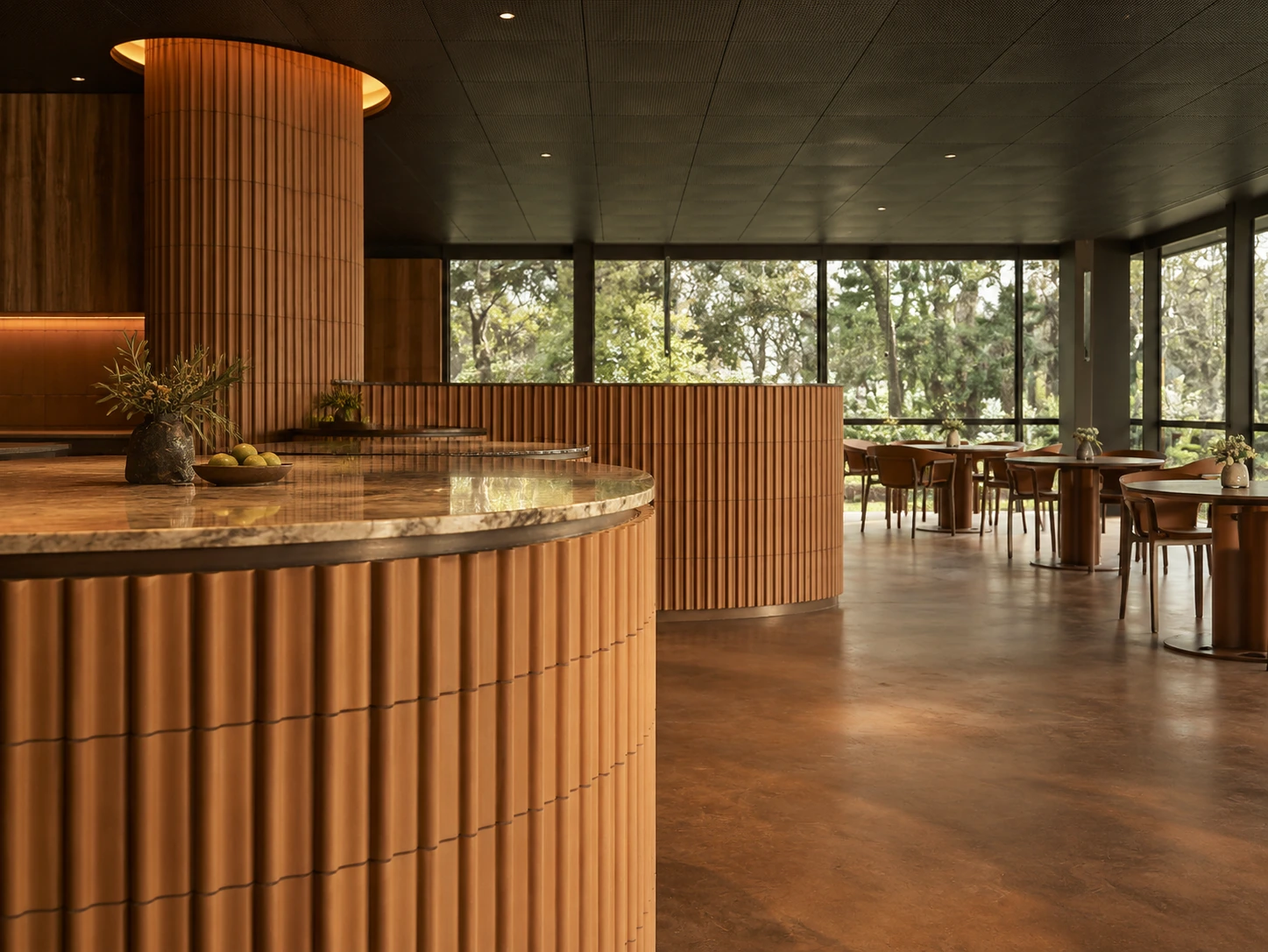 Terracotta-clad pass and garden windows at Yiaga