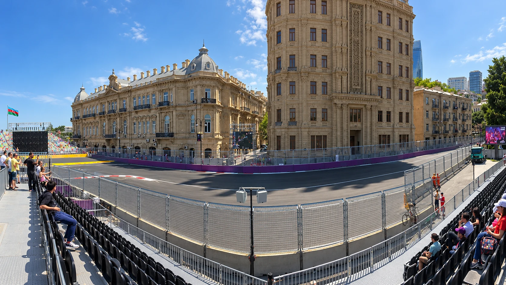 Filarmoniya grandstand overlooks Baku City Circuit’s Turn 16 beside ornate stone city facades.