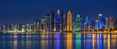 Destination artwork of Doha: Doha West Bay skyline at night with luminous towers reflecting in the calm bay, deep cobalt sky and elegant city lights.