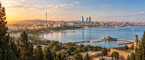 Destination artwork of Baku: Baku's seaside street circuit along the Caspian waterfront, surrounding city skyline and old city texture.