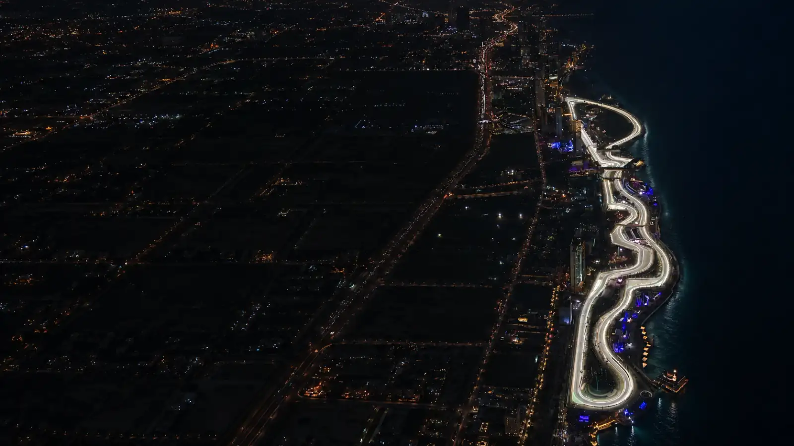 Floodlit Jeddah Corniche Circuit and the Red Sea at night
