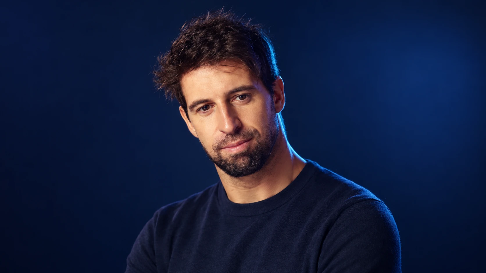 António Félix da Costa in a navy shirt against a dark background.