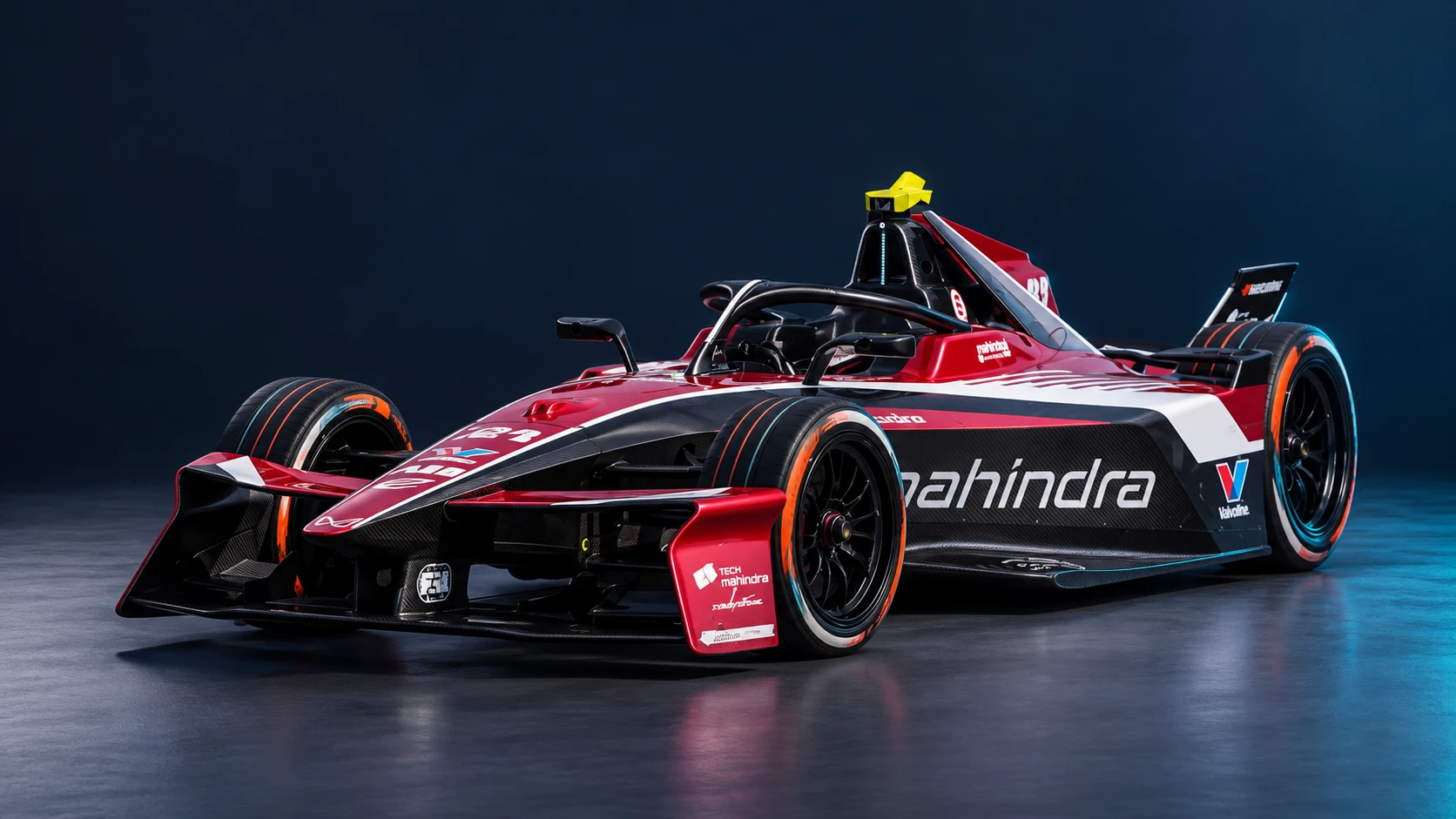 Mahindra Racing Formula E car in a front three-quarter view.