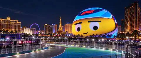 Destination artwork of Las Vegas: Las Vegas Strip at night with glowing Sphere, illuminated race circuit and resort skyline.