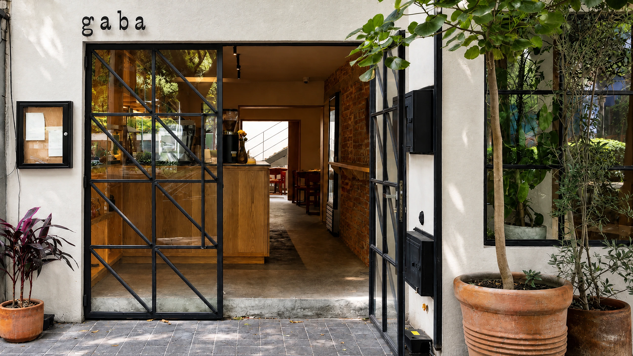 Gaba’s black-framed entrance and small white façade in Condesa