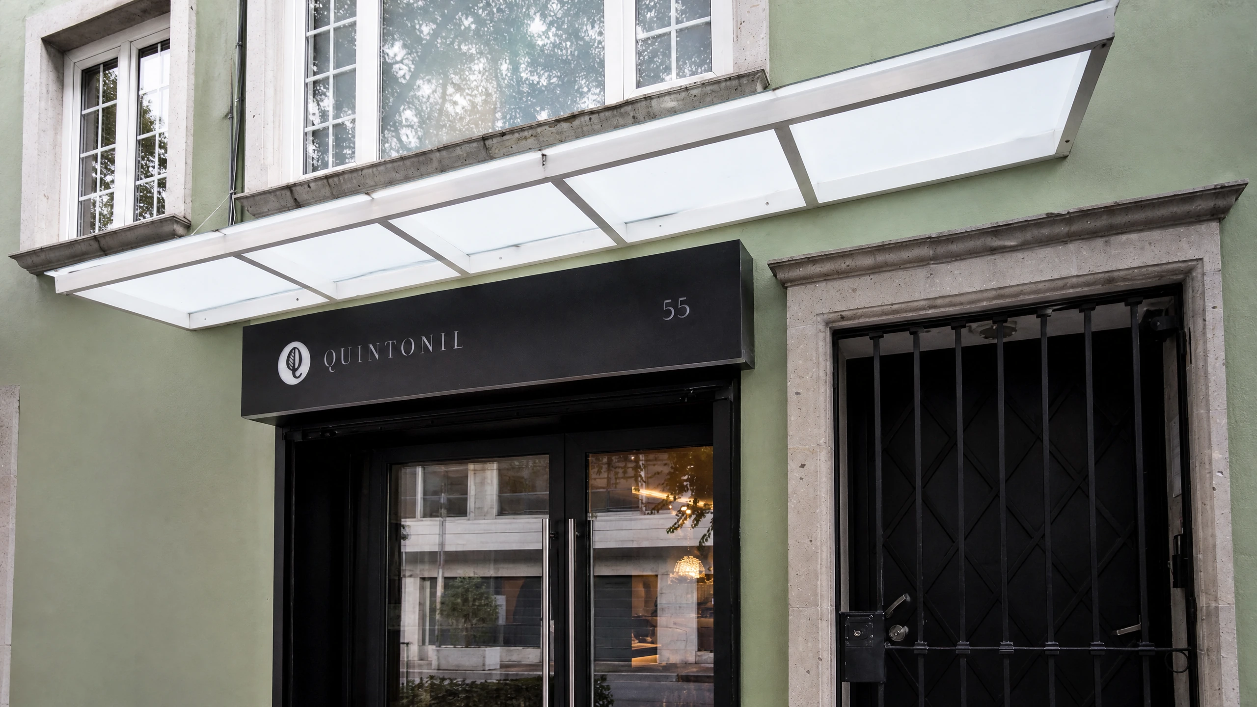 Quintonil’s entrance beneath its black sign at Newton 55