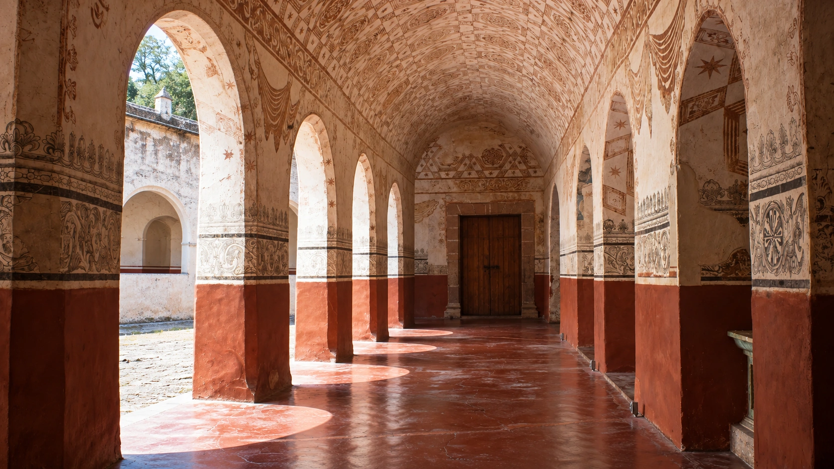 Vaulted ground-floor corridor and murals at Tepoztlán’s convent