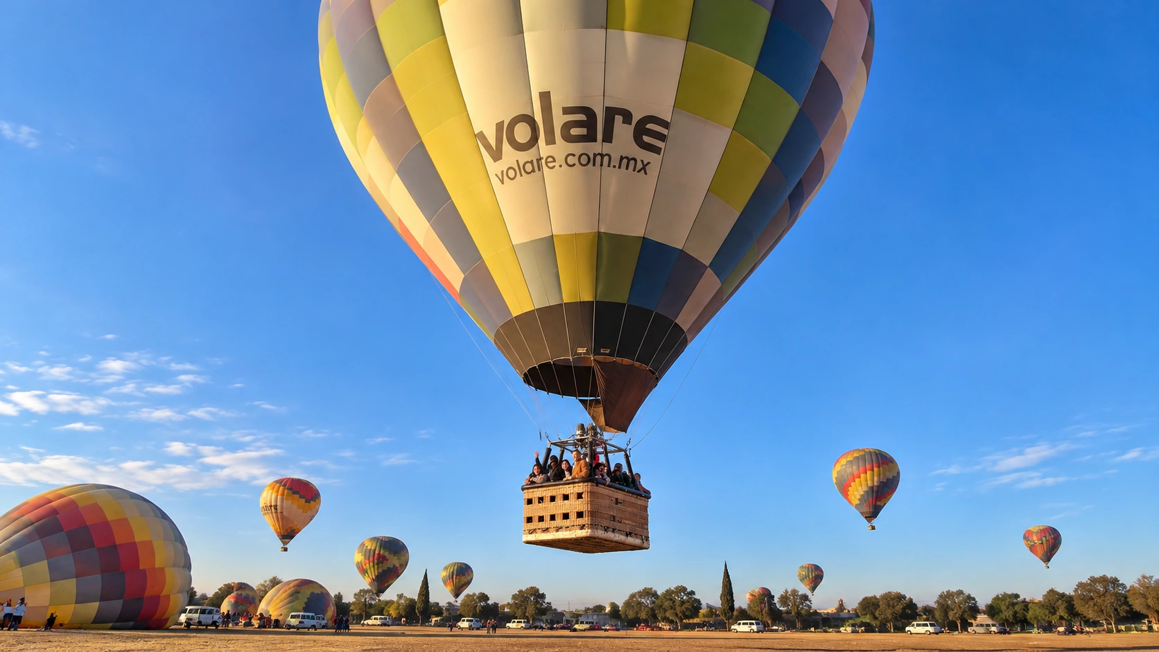 A Volare balloon rising above the launch field