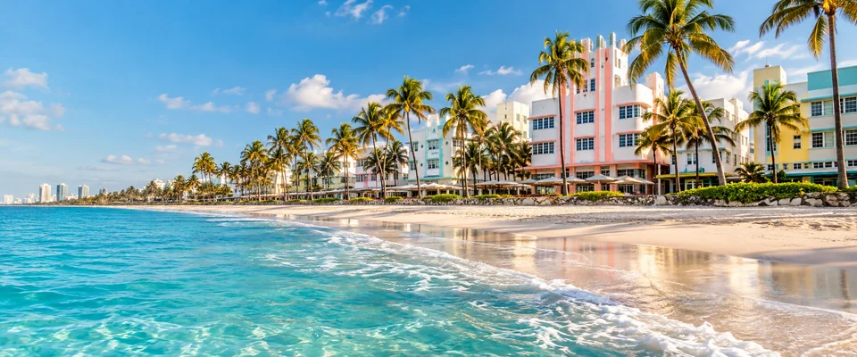 Destination artwork of Miami: Miami Beach's pastel Art Deco waterfront architecture, tall palm trees, white sand and turquoise Atlantic water under bright Florida sunlight.