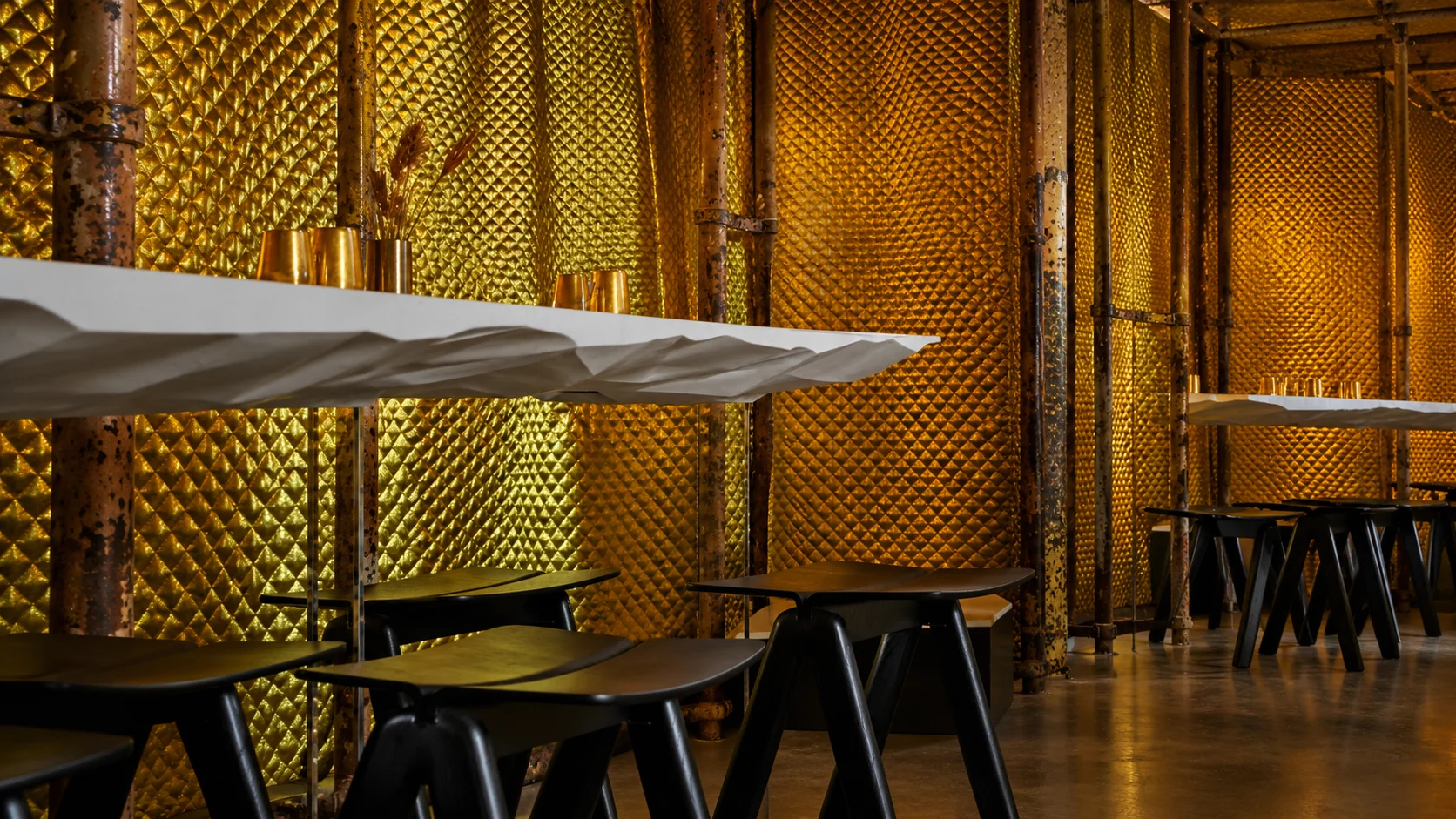 Gold curtains and cocktail tables