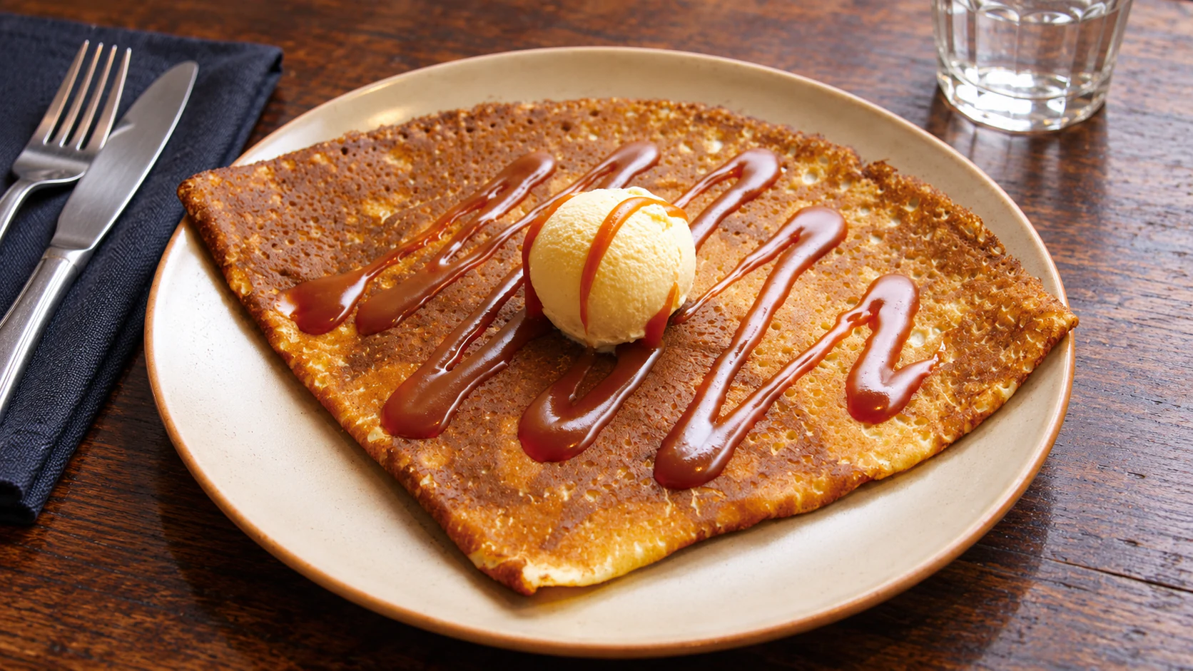 A folded wheat crêpe with salted-butter caramel and vanilla ice cream at Breizh Café Odéon.