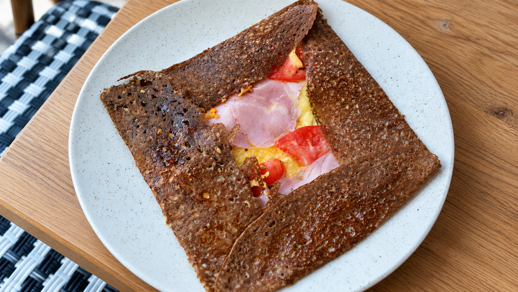 Buckwheat galette filled with tomato, scrambled egg, Comté and ham, as served at Breizh Café Odéon.