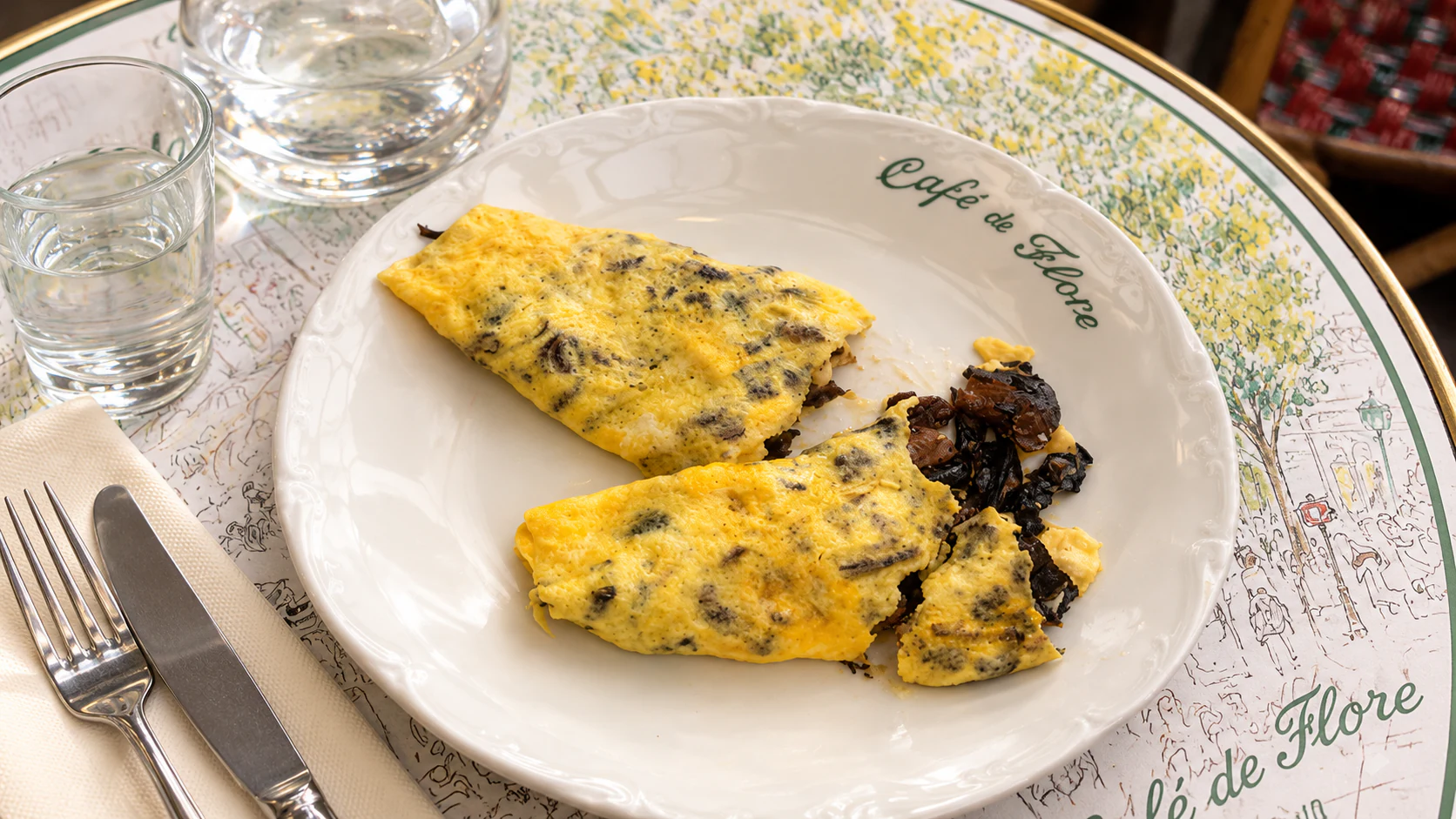 Wild-mushroom omelette, with folded golden eggs and visible mushrooms, at Café de Flore.