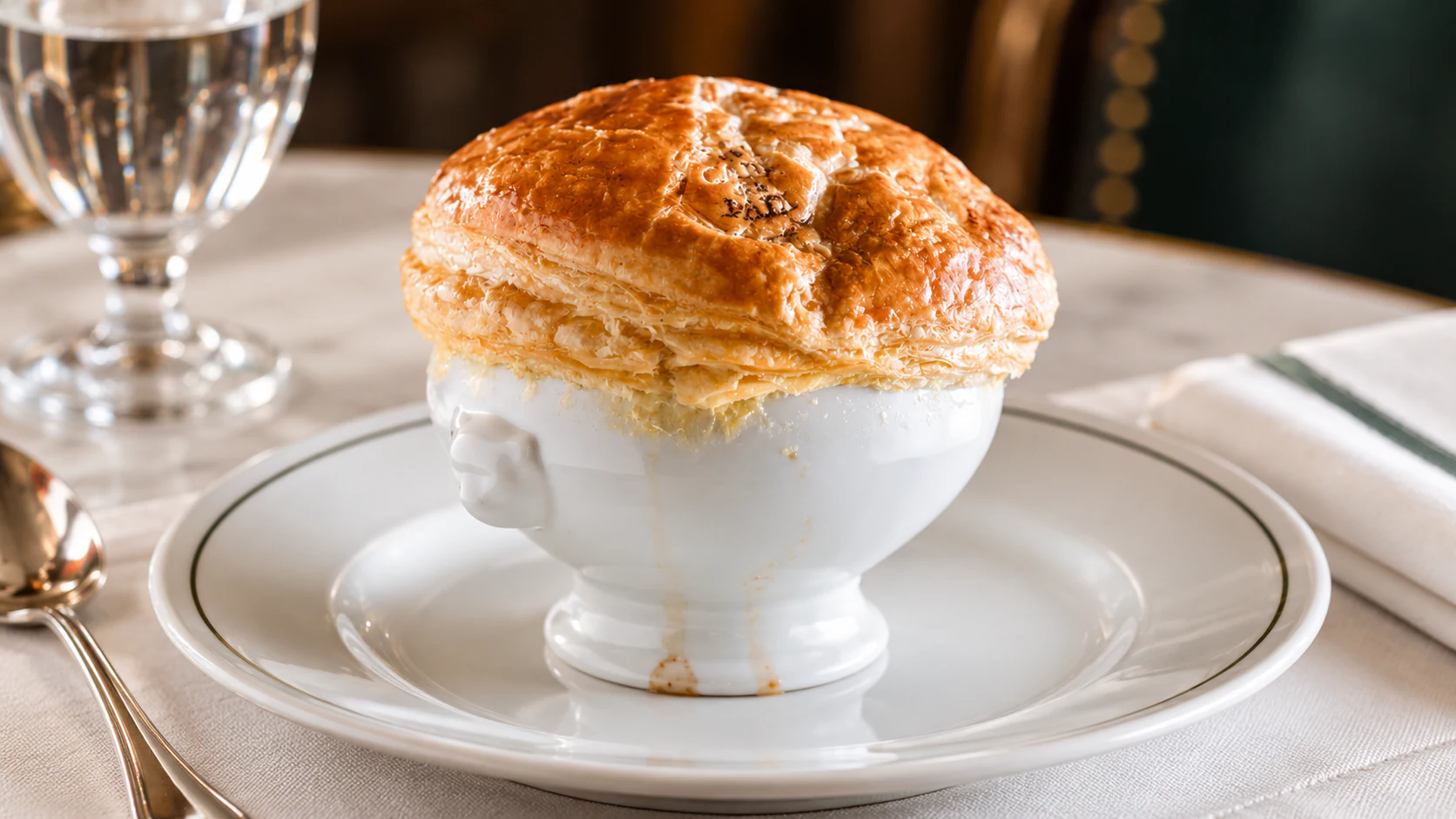 Onion soup with black truffle beneath a domed puff-pastry lid at Café de la Paix.