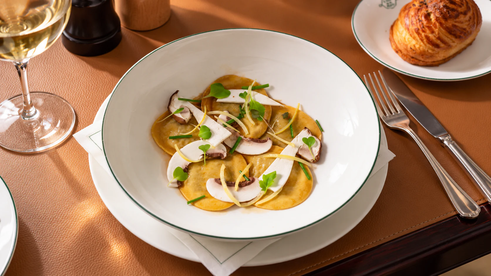 Porcini mushroom ravioli with baby spinach and toasted hazelnuts at Café de la Paix.