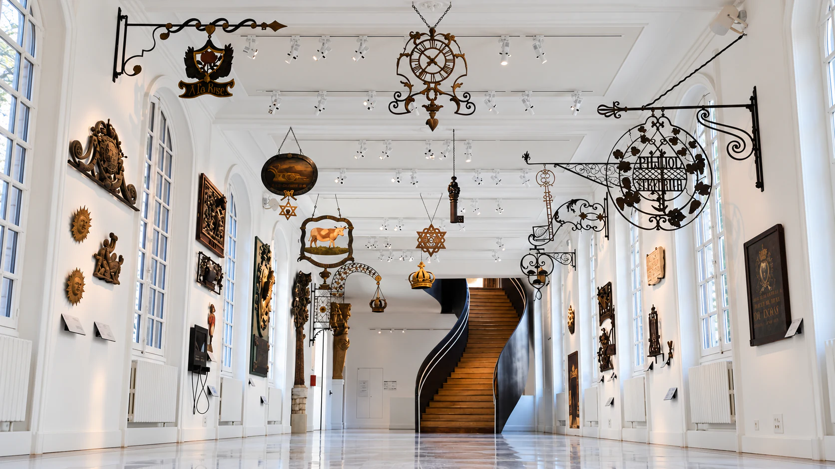 Historic Paris shop signs in the Musée Carnavalet gallery